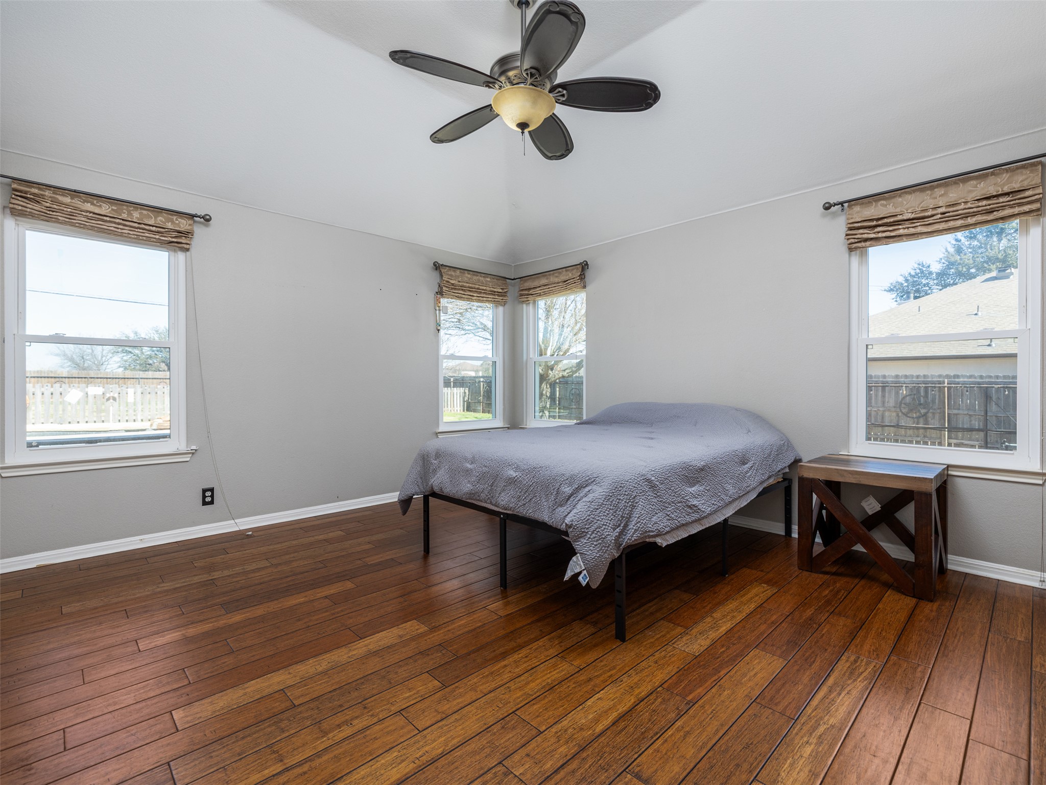 208 South Buffalo Pass Georgetown, TX 78633 - Photo 11 of 28 Bedroom featuring a ceiling fan, dark wood-type flooring, and lofted ceiling