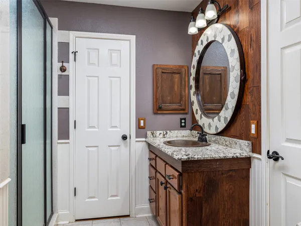 a bathroom with a sink and a mirror