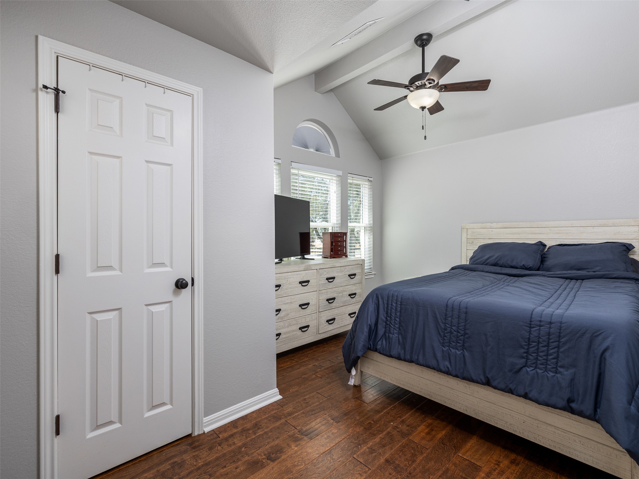 208 South Buffalo Pass Georgetown, TX 78633 - Photo 15 of 28 Bedroom featuring a ceiling fan, dark wood-style flooring, and beam ceiling