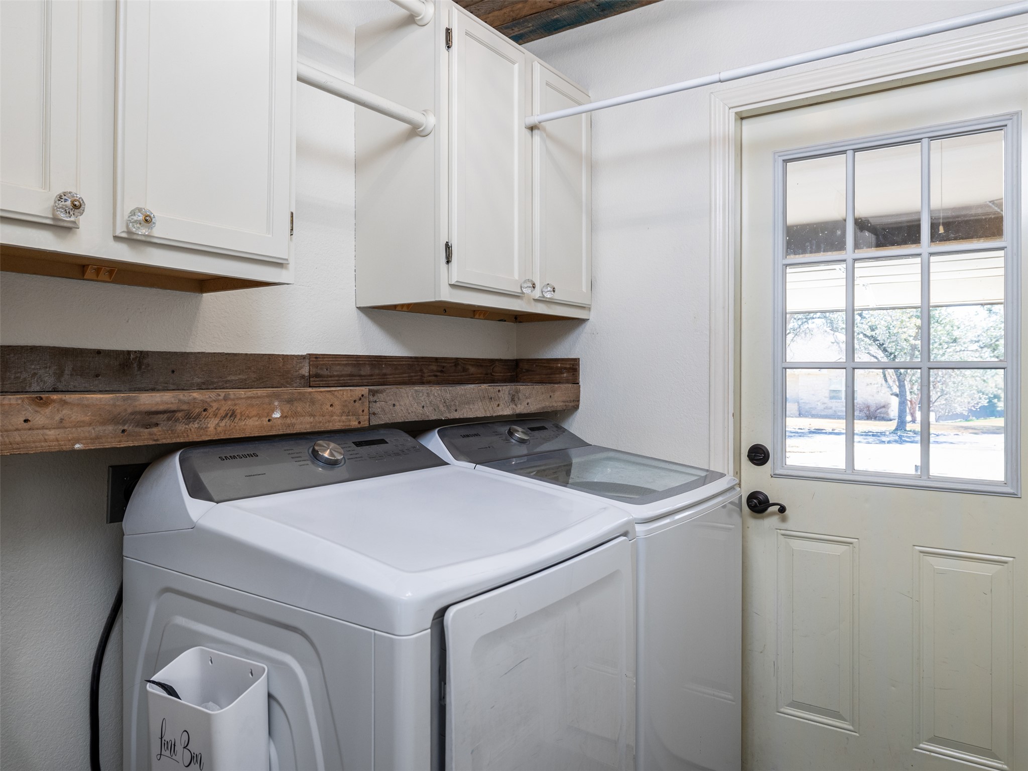 208 South Buffalo Pass Georgetown, TX 78633 - Photo 18 of 28 Laundry area featuring cabinet space and independent washer and dryer
