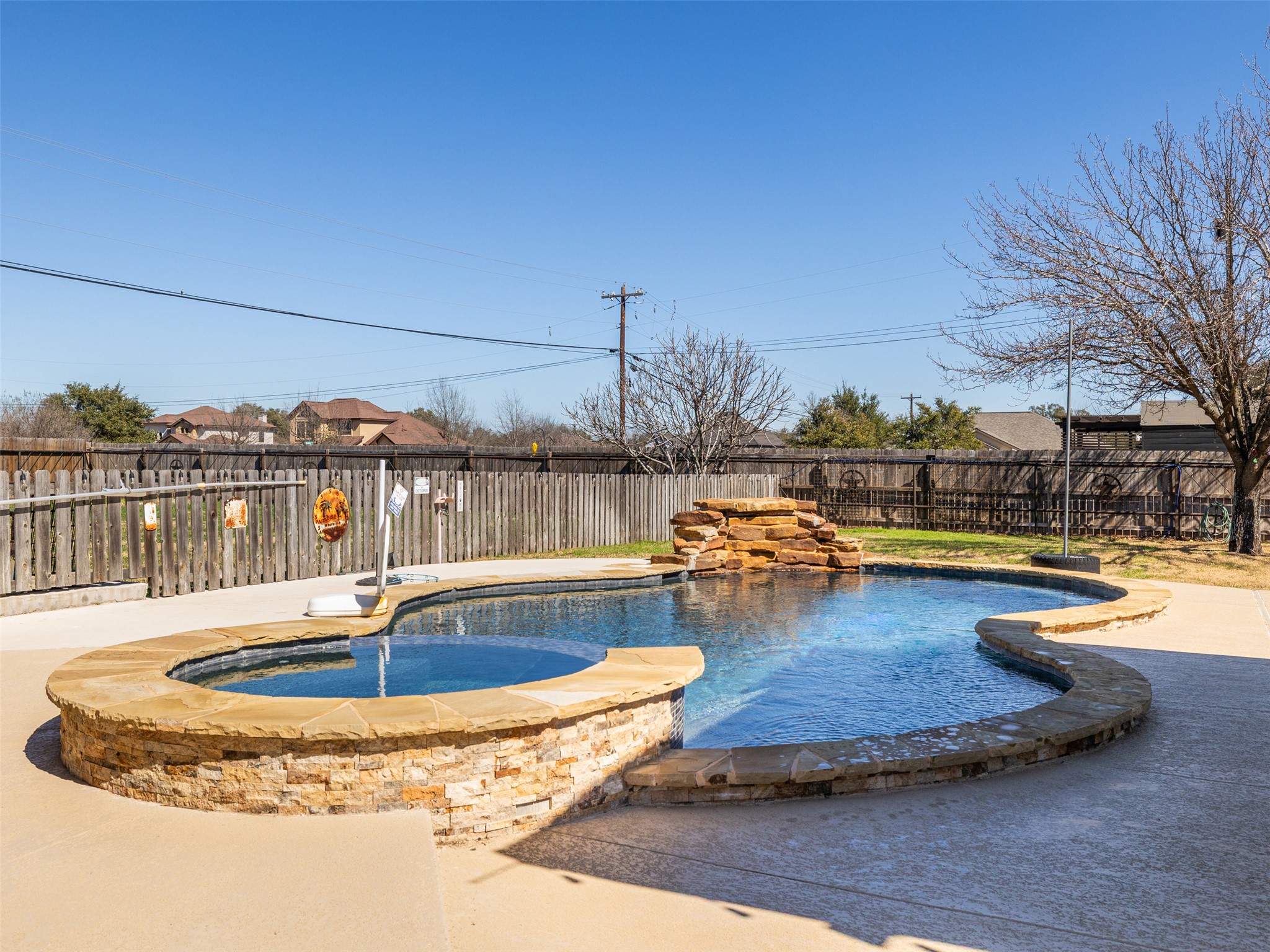 208 South Buffalo Pass Georgetown, TX 78633 - Photo 21 of 28 View of swimming pool with a fenced backyard, an in-ground hot tub, and patio surround