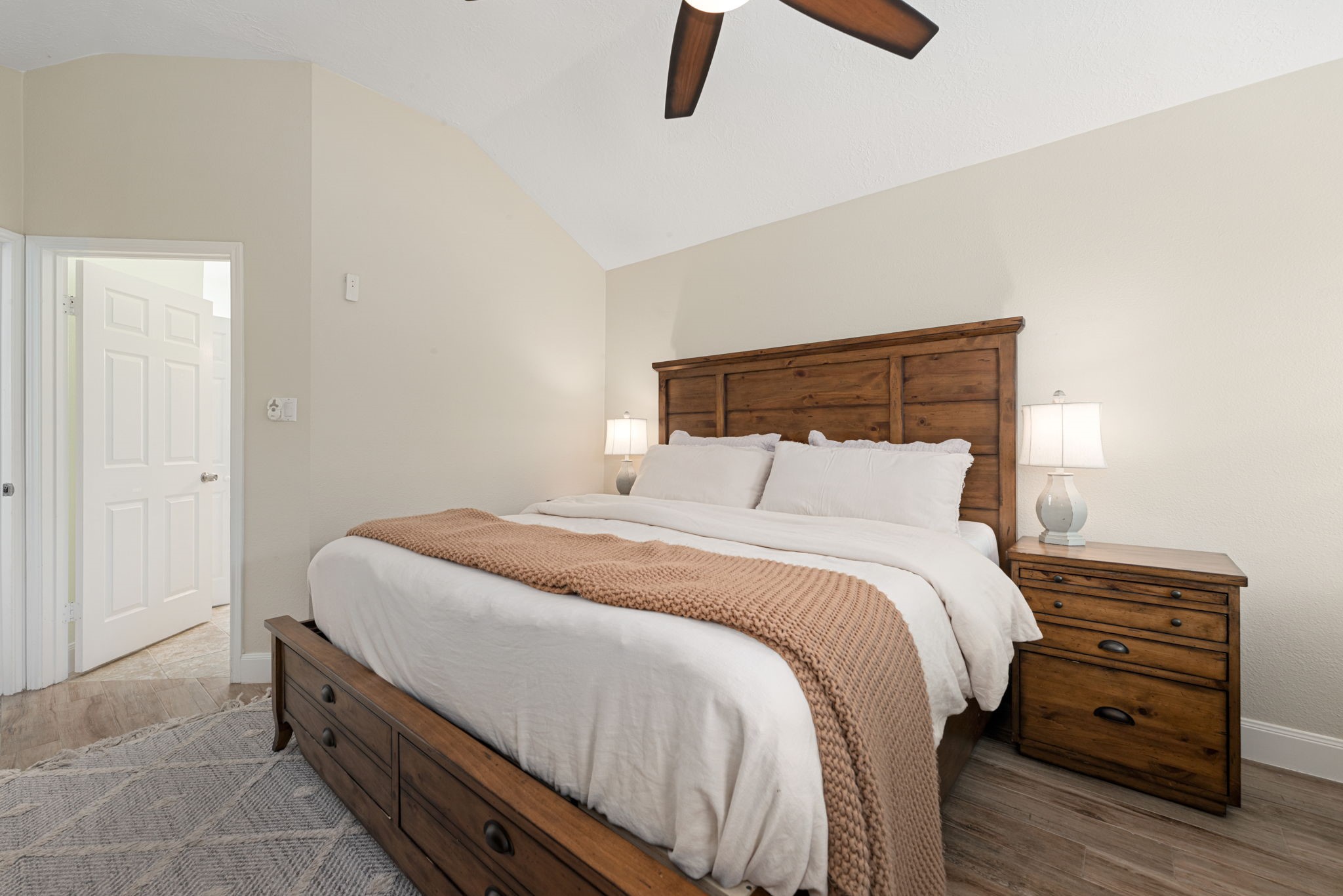 1915 Mercoal Drive Spring, TX 77386 - Photo 17 of 50 Comfortable primary suite featuring a ceiling fan and ample space for a king-size bed.