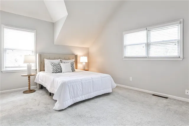 a bedroom with a bed and window