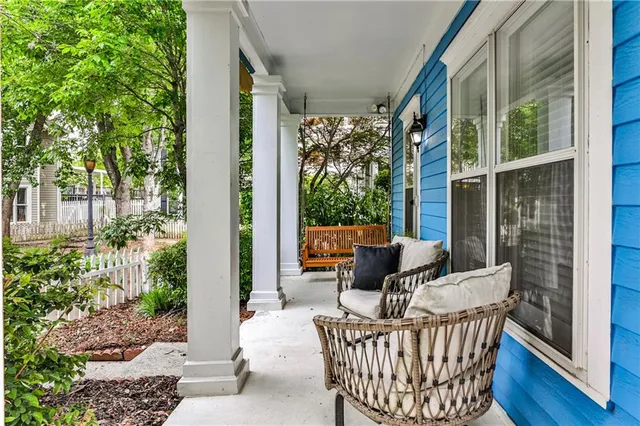 a view of a chair and table in the balcony