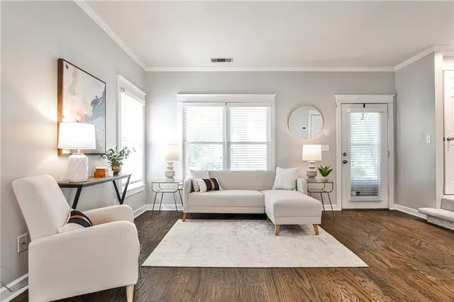 a living room with furniture and a large window
