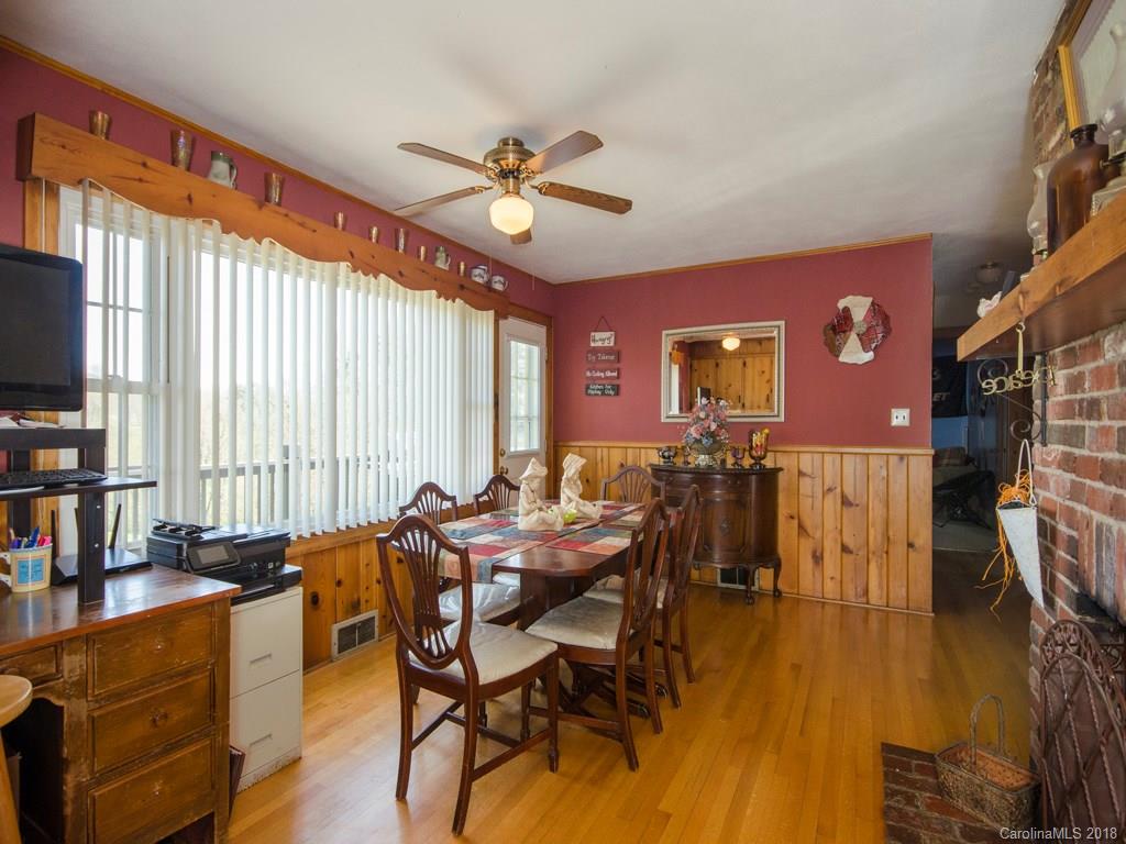 9 Star Ridge Road Canton, NC 28716 - Photo 4 of 13 a view of a dining room with furniture window and wooden floor