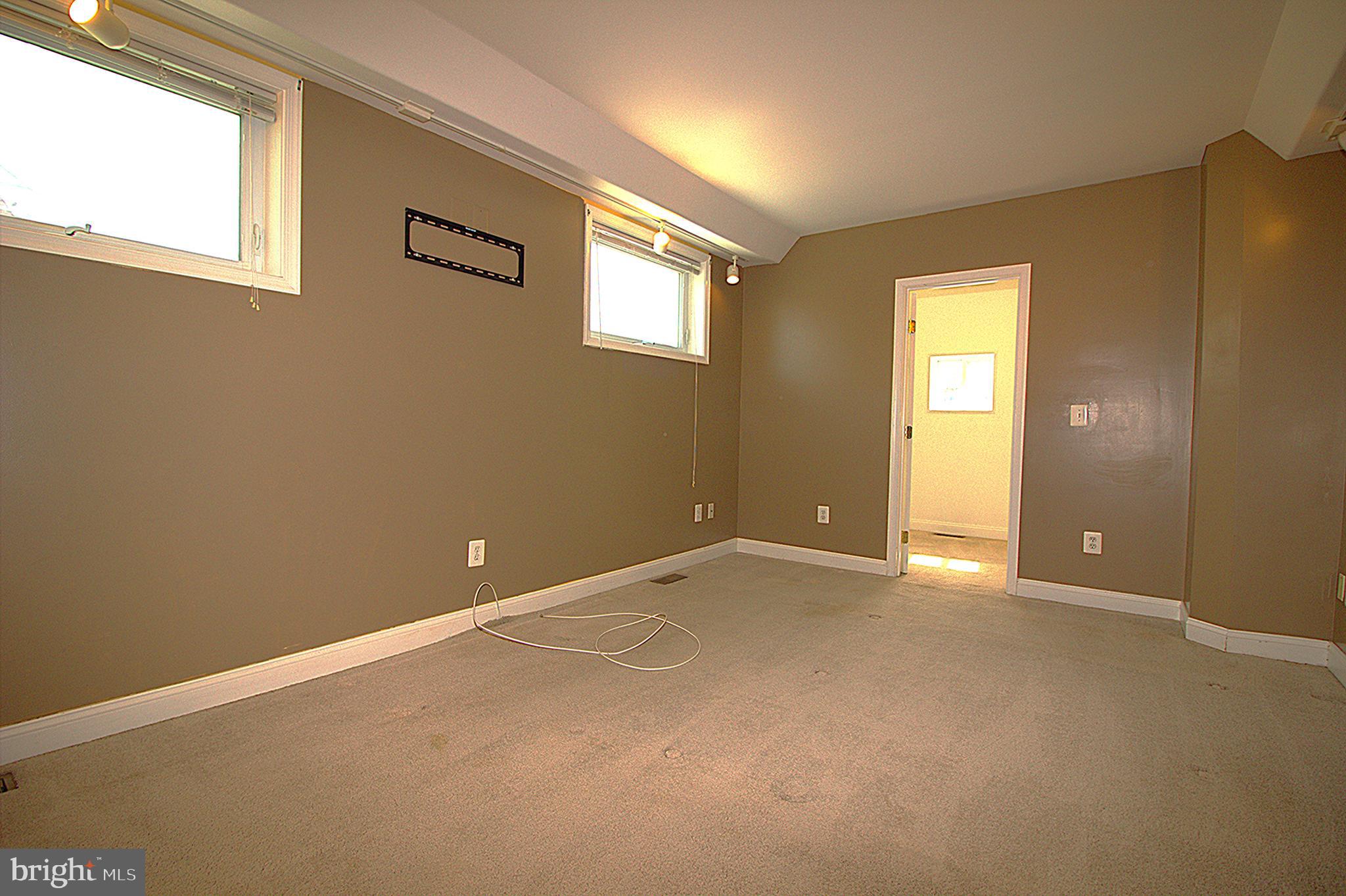 2919 Ritchie Avenue Baltimore, MD 21219 - Photo 12 of 24 a view of an empty room with a window