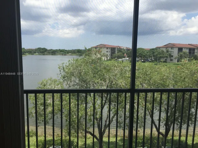 a view of a balcony with lake from a balcony