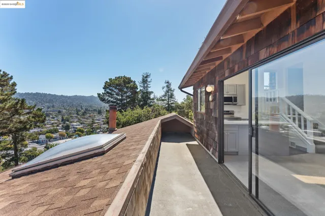 an empty room with windows and entrance