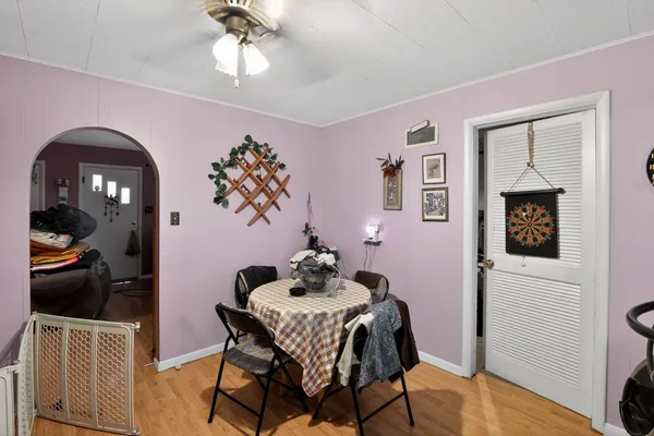 a dining room with furniture and window