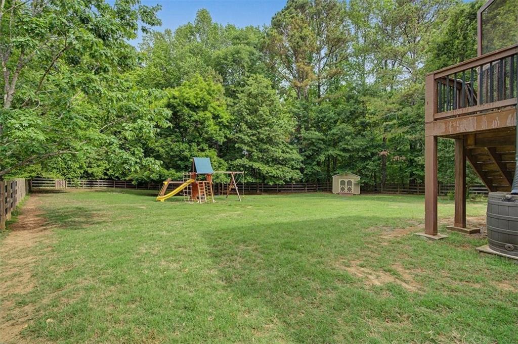 409 Windsor Way Canton, GA 30115 - Photo 37 of 51 a front view of a house with a yard