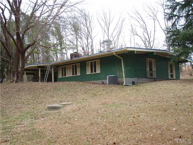 117 Bowden Road Chapel Hill, NC 27516 - Photo 11 of 12 a backyard of a house with large trees