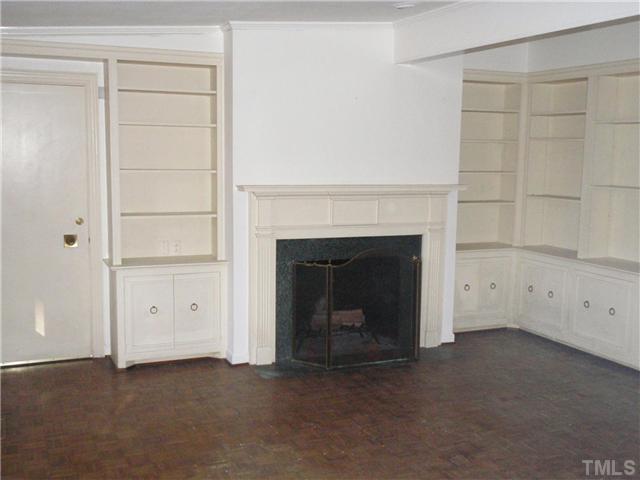 117 Bowden Road Chapel Hill, NC 27516 - Photo 4 of 12 a view of an empty room with a fireplace
