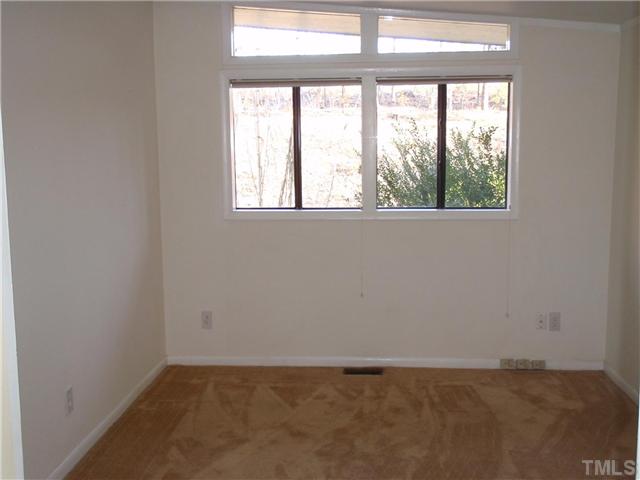 117 Bowden Road Chapel Hill, NC 27516 - Photo 5 of 12 an empty room with a window