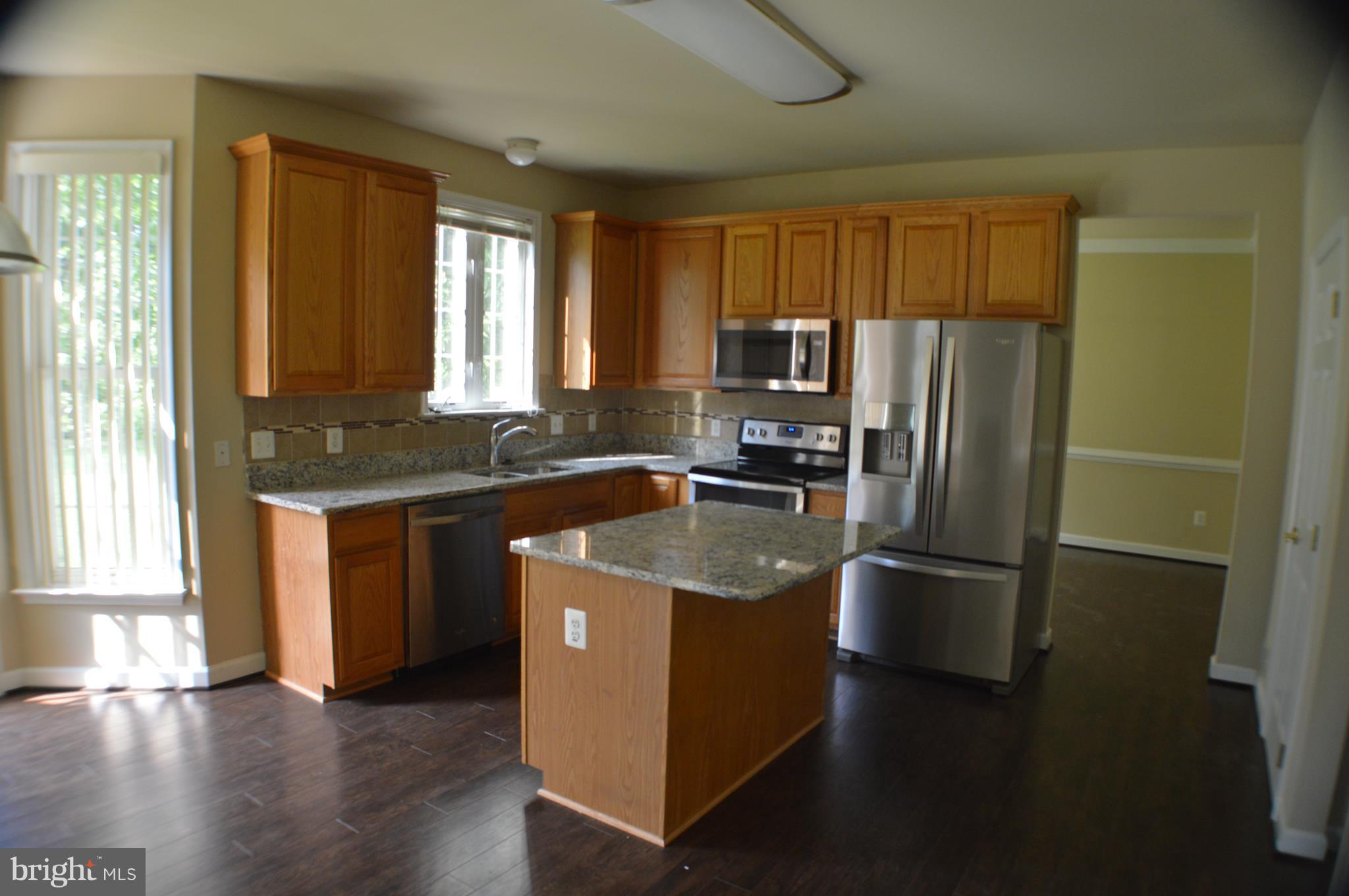 8408 Lark Brown Road Columbia, MD 21045 - Photo 11 of 30 Kitchen new stainless steel appliances and granite