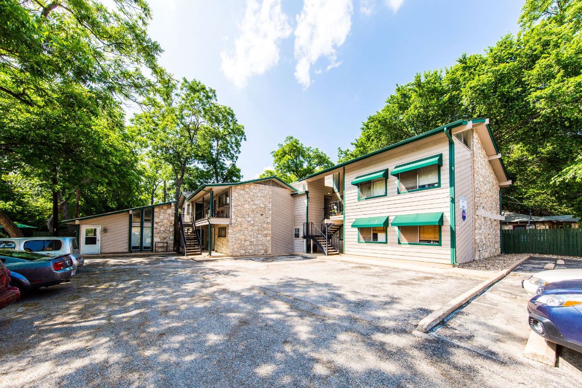 4510 Duval Street, Unit 101 Austin, TX 78751 - Photo 1 of 8 a view of a house with a big yard and large tree