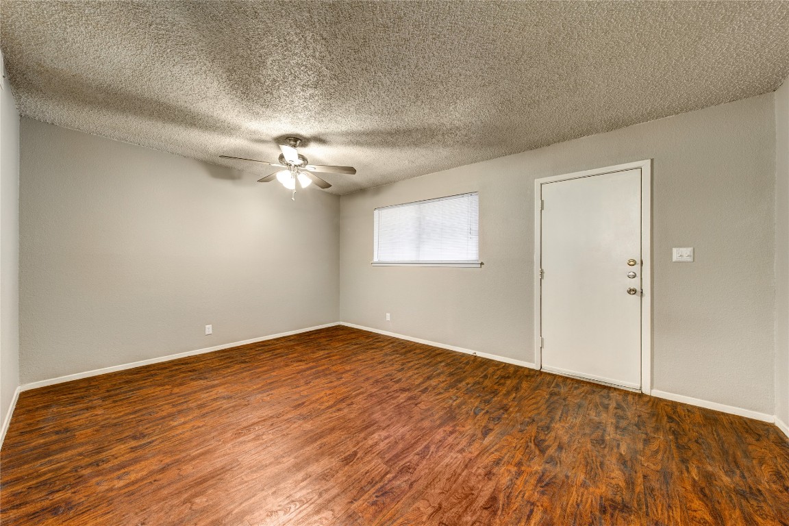4510 Duval Street, Unit 101 Austin, TX 78751 - Photo 6 of 8 a view of an empty room with a chandelier fan