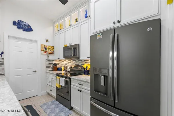a kitchen with a sink and a stove