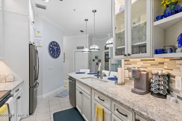 a bedroom with a bed next to a window with the outer view