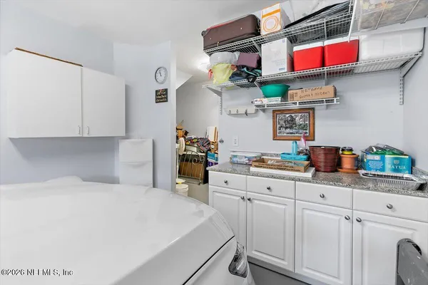 an aerial view of residential houses with city view