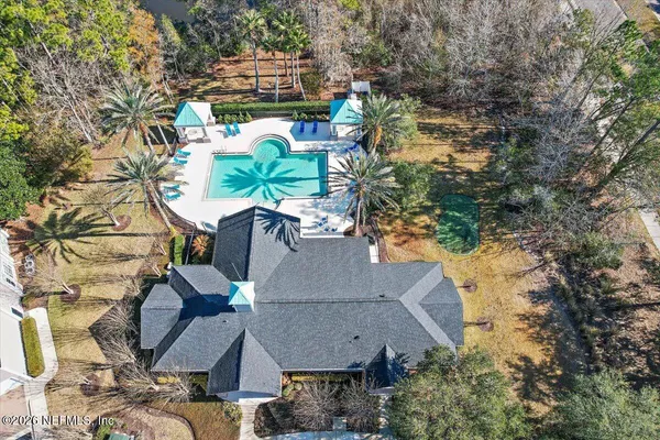 a view of swimming pool with outdoor seating