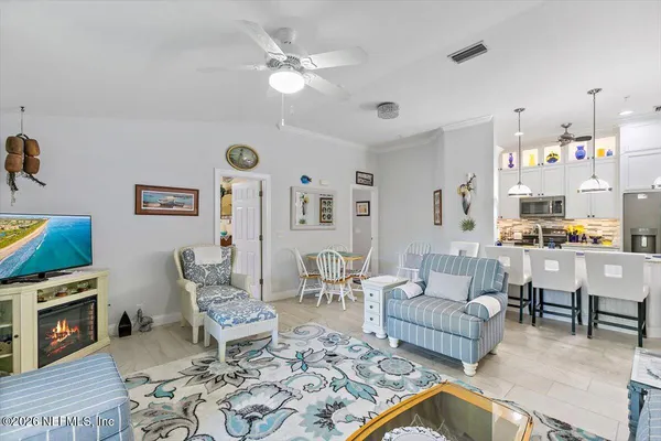 a dining room with furniture and window