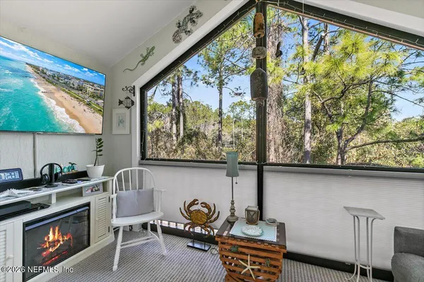 a kitchen with stainless steel appliances granite countertop a dining table and chairs