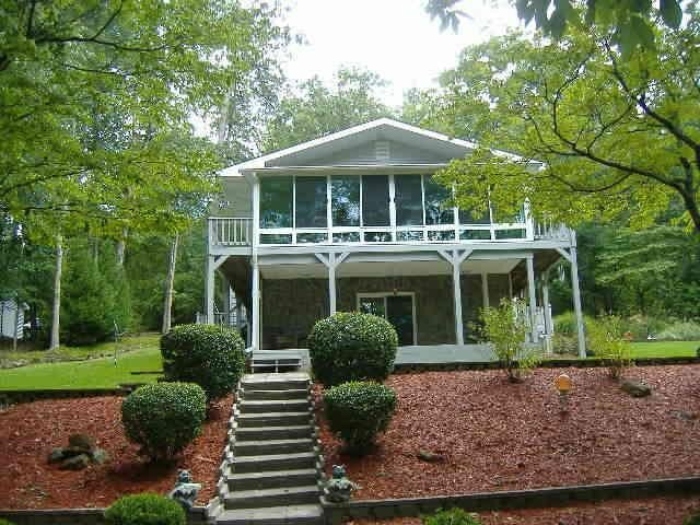 141 Lake Pines Road, Unit A Jackson, GA 30233 - Photo 1 of 1 a front view of a house with garden