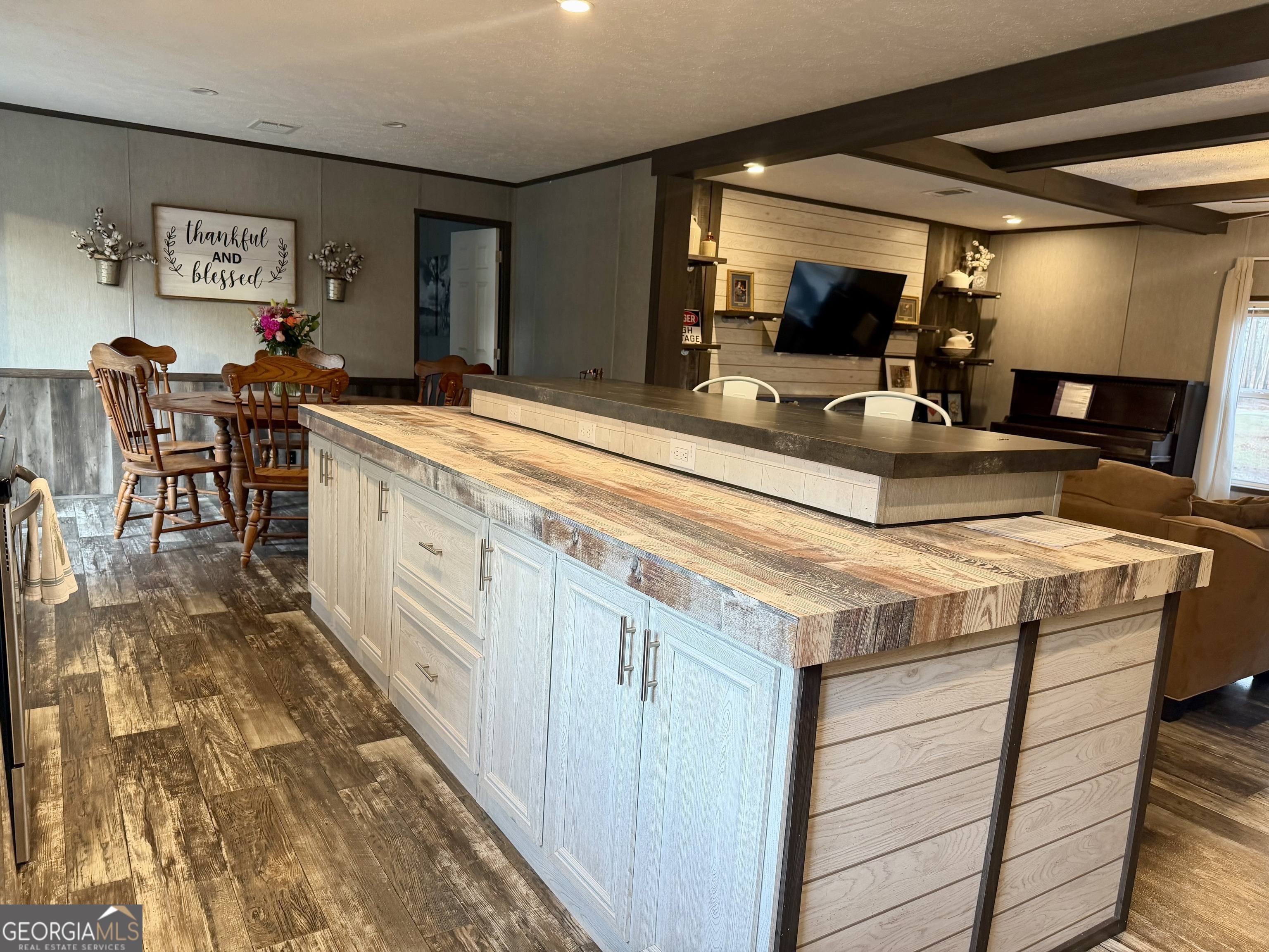 2601 New Evergreen Church Road Cadwell, GA 31009 - Photo 12 of 30 a living room with stainless steel appliances kitchen island granite countertop furniture and a large window