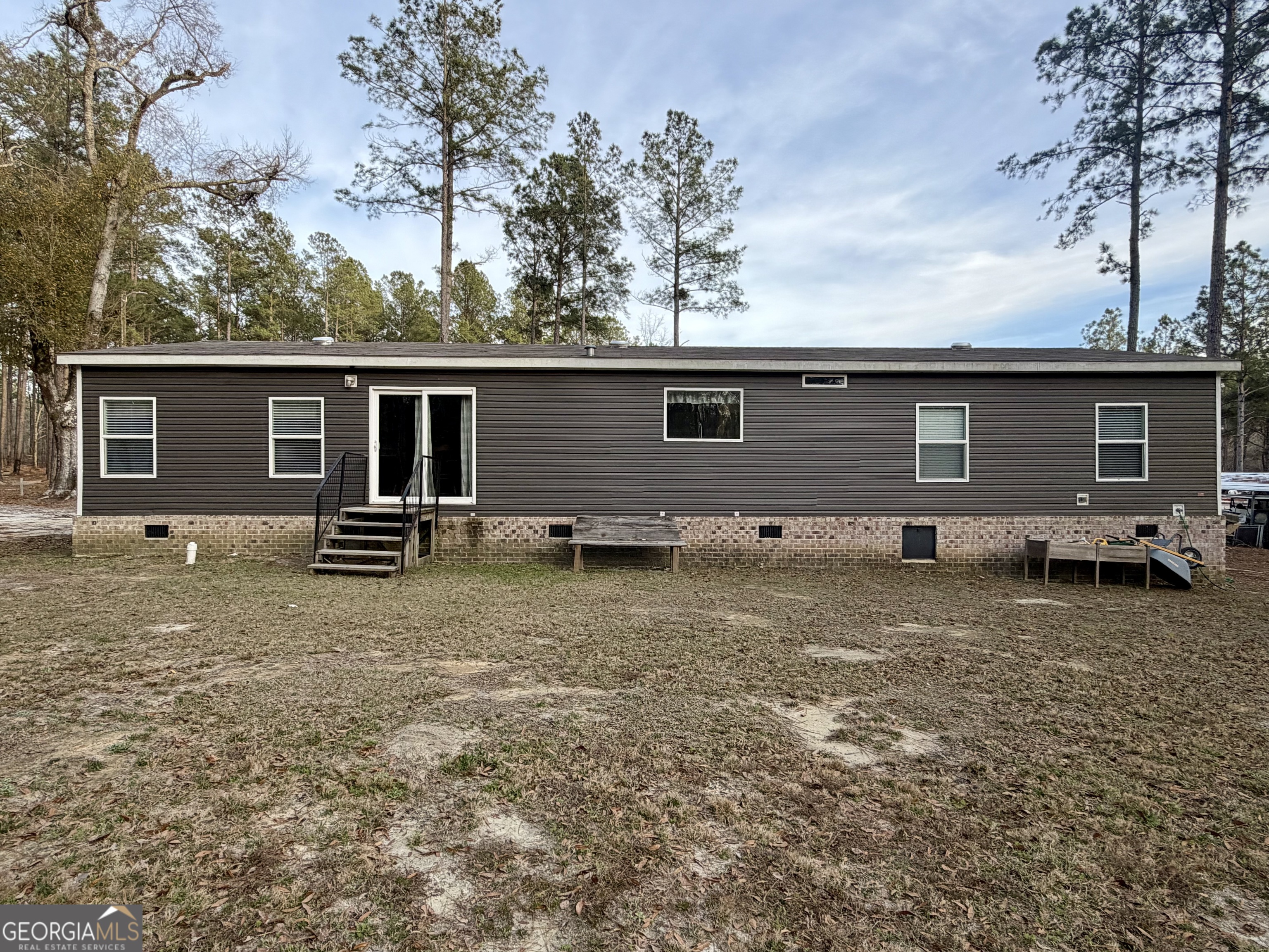 2601 New Evergreen Church Road Cadwell, GA 31009 - Photo 2 of 30 a backyard of a house with barbeque oven