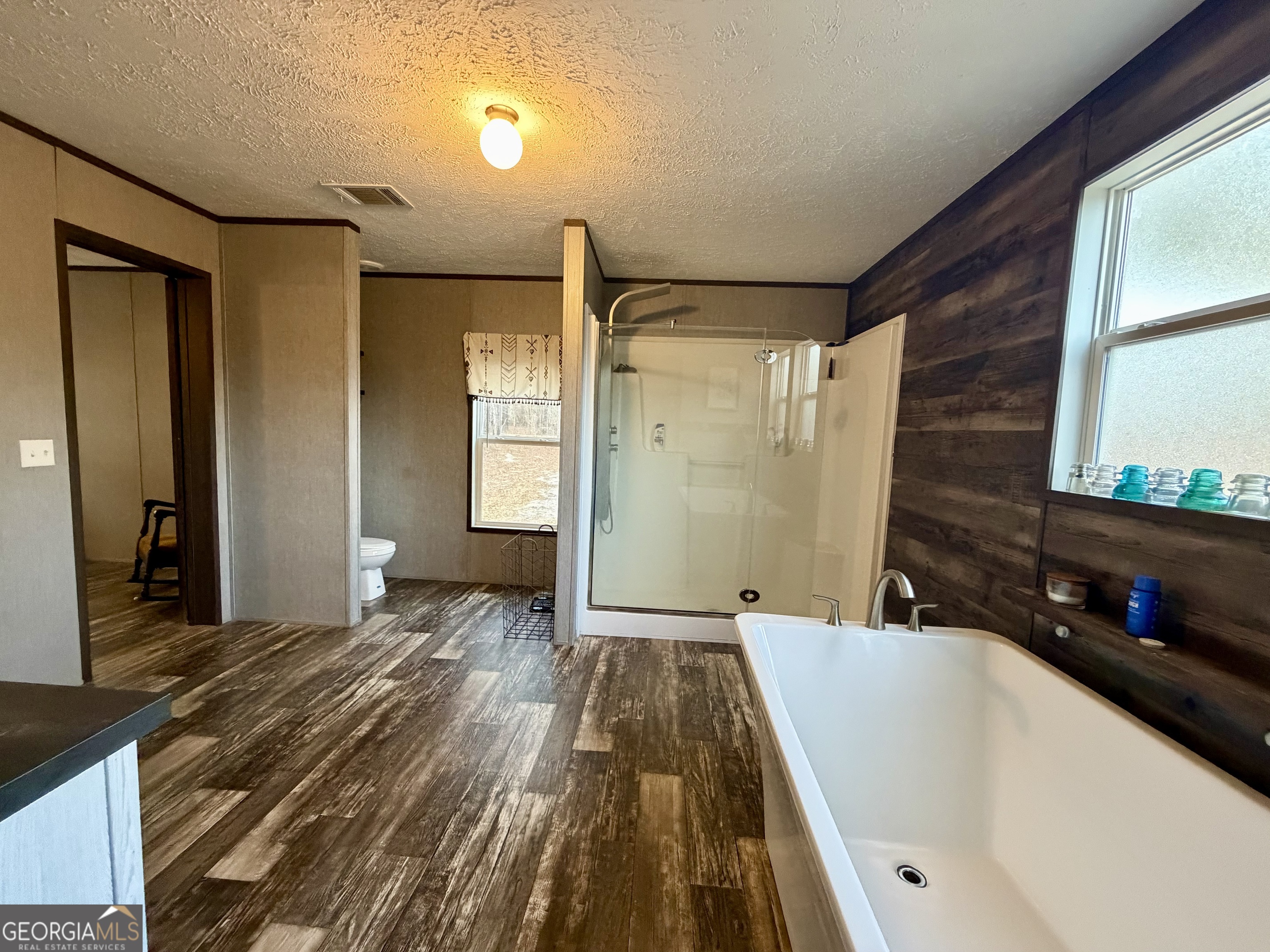2601 New Evergreen Church Road Cadwell, GA 31009 - Photo 25 of 30 a bathroom with a tub sink and mirror