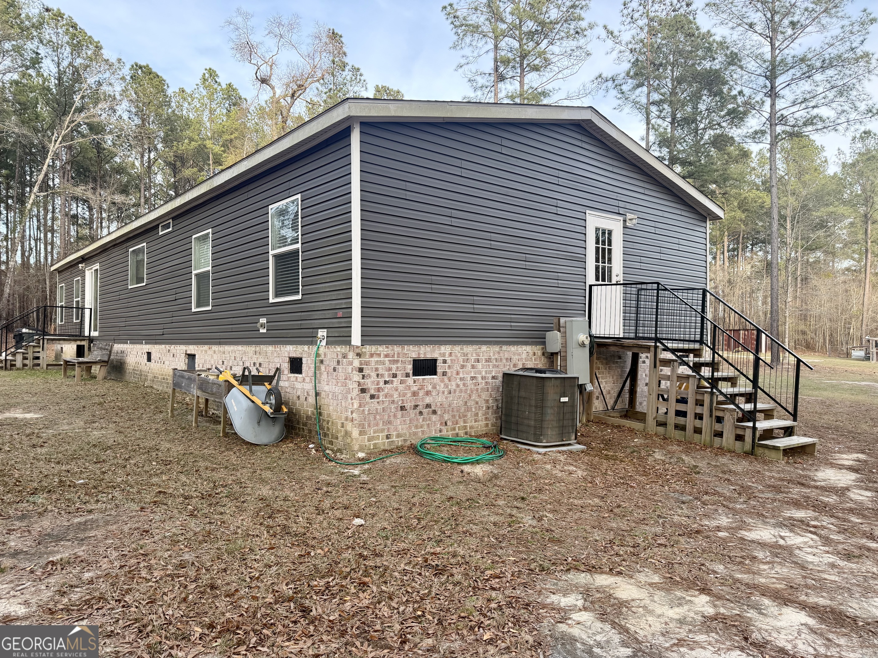 2601 New Evergreen Church Road Cadwell, GA 31009 - Photo 3 of 30 a front view of a house with patio