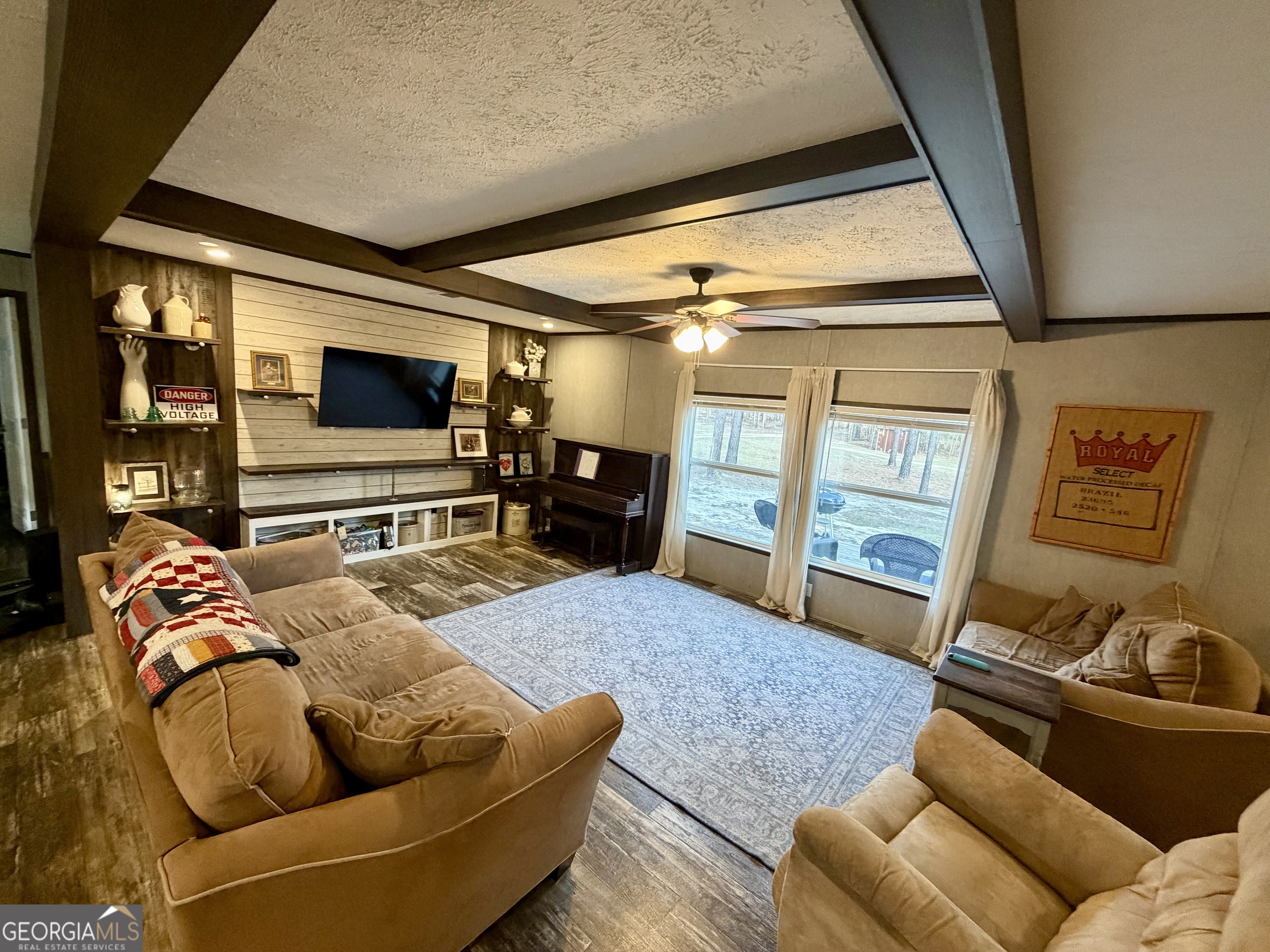 2601 New Evergreen Church Road Cadwell, GA 31009 - Photo 6 of 30 a living room with fireplace furniture and a flat screen tv