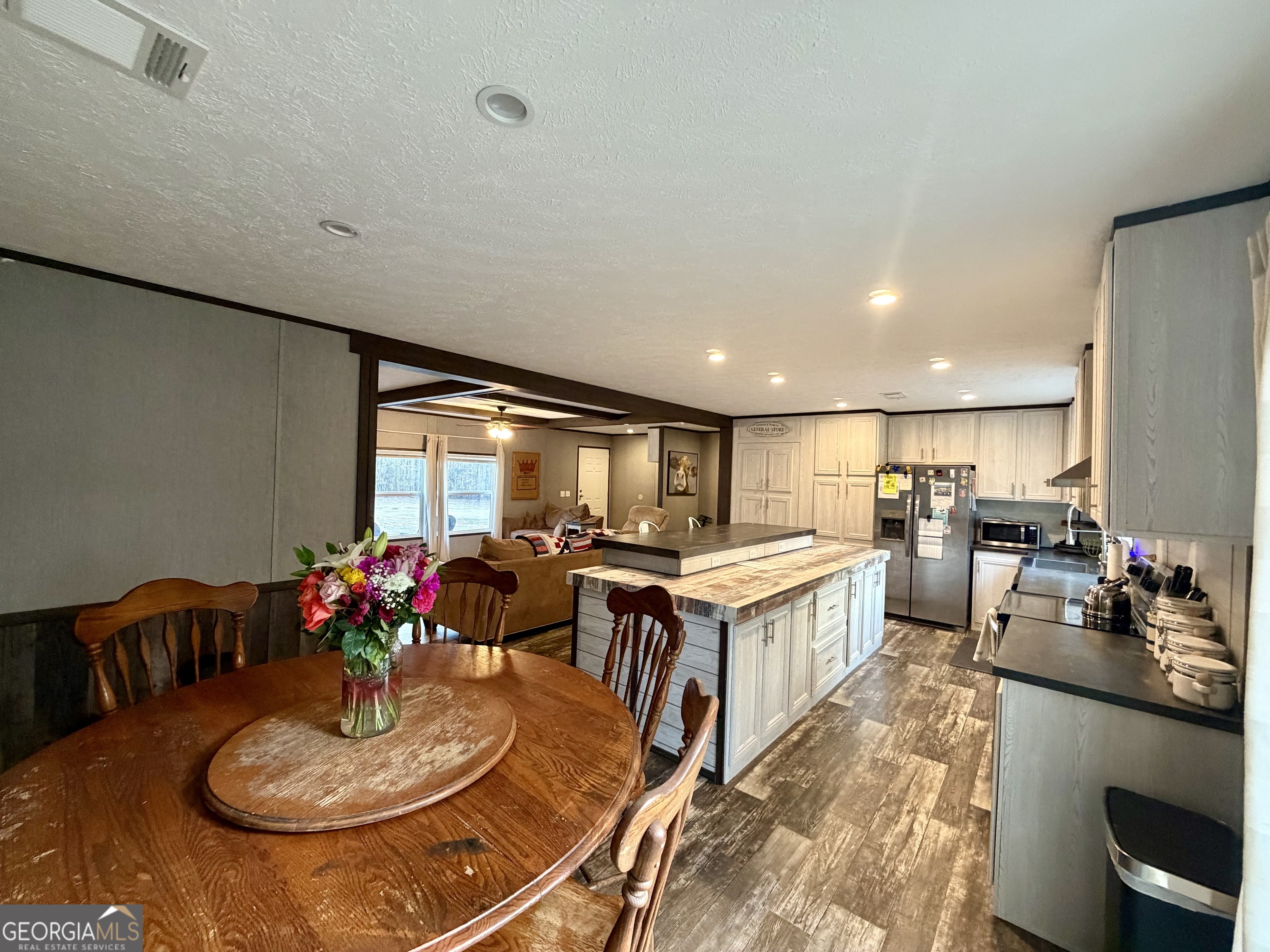 2601 New Evergreen Church Road Cadwell, GA 31009 - Photo 9 of 30 a kitchen with a dining table and chairs