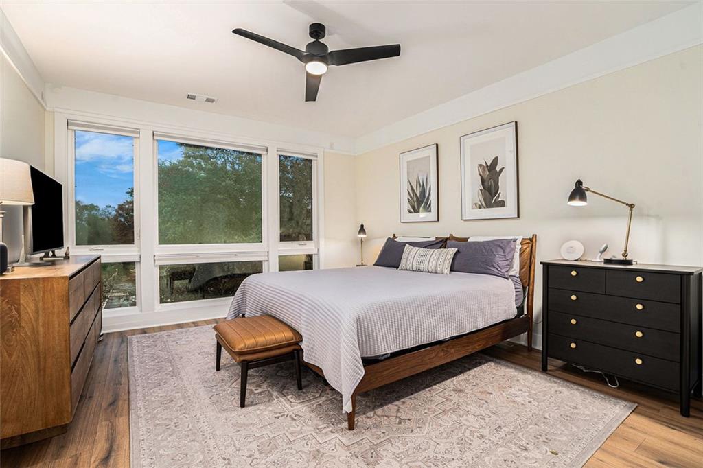 1649 Overlook Way Northwest Atlanta, GA 30324 - Photo 14 of 29 a bedroom with a bed a large window and flat screen tv