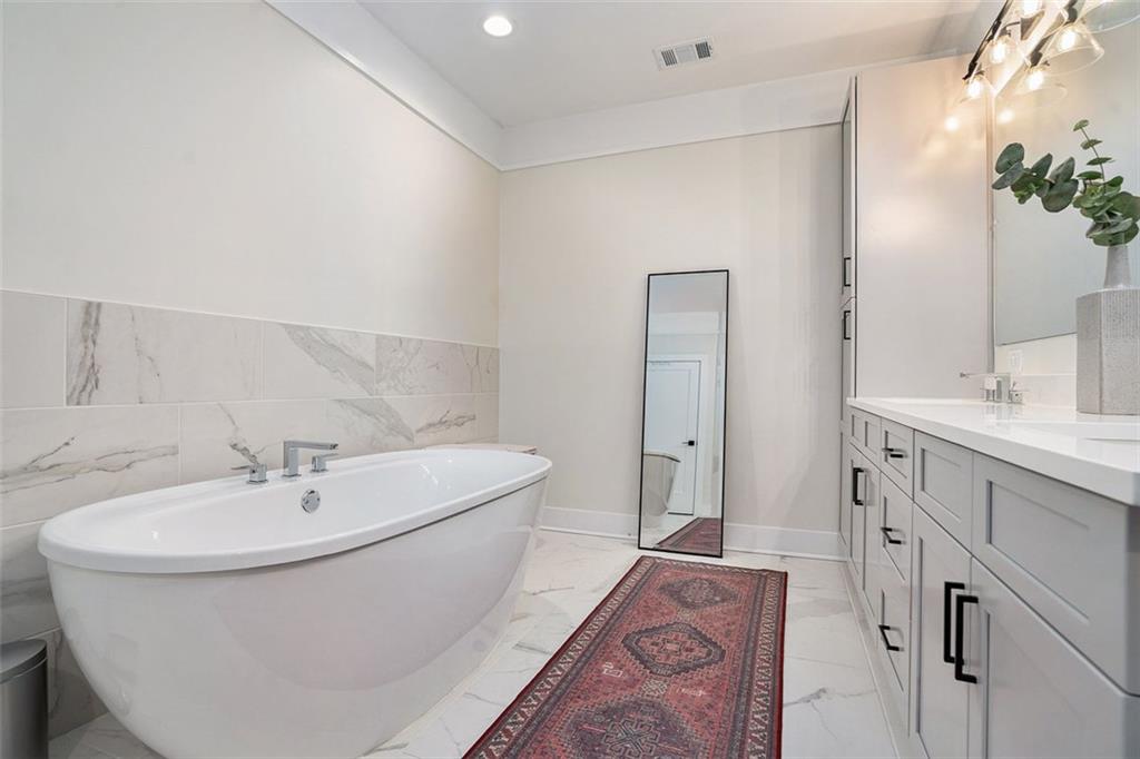 1649 Overlook Way Northwest Atlanta, GA 30324 - Photo 17 of 29 a bathroom with a sink and a mirror