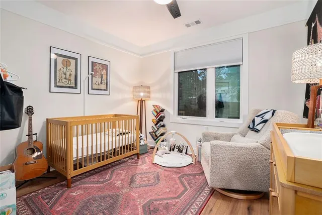 a bedroom with furniture and a window