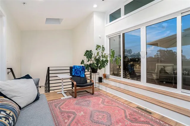 a living room with furniture lamp and rug