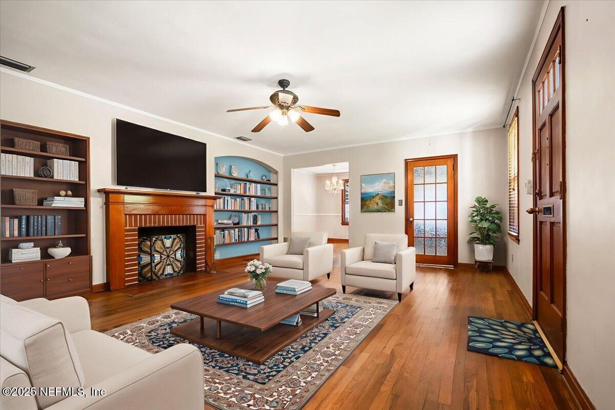 5249 Birkenhead Road Jacksonville, FL 32210 - Photo 4 of 32 a living room with fireplace furniture and a flat screen tv