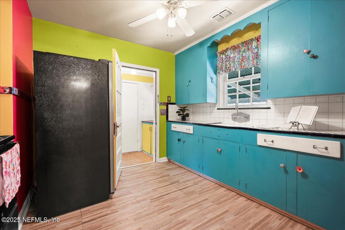 5249 Birkenhead Road Jacksonville, FL 32210 - Photo 8 of 32 a kitchen with a refrigerator and a sink