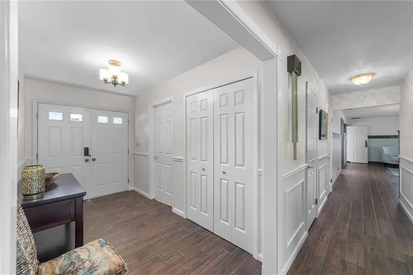a view of hallway with wooden floor