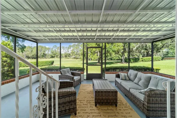 a living room with large windows