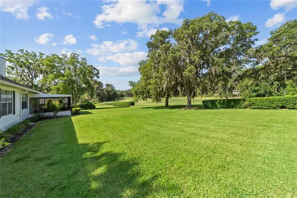 a view of a house with a big yard