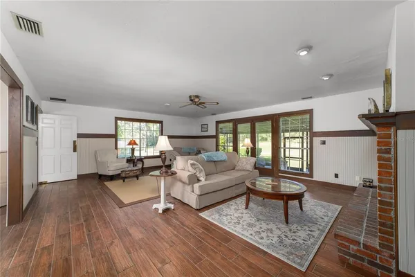 a living room with furniture and a window