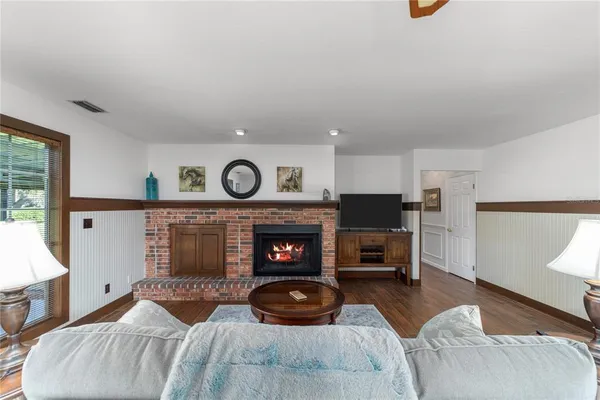 a bedroom with furniture and a fireplace
