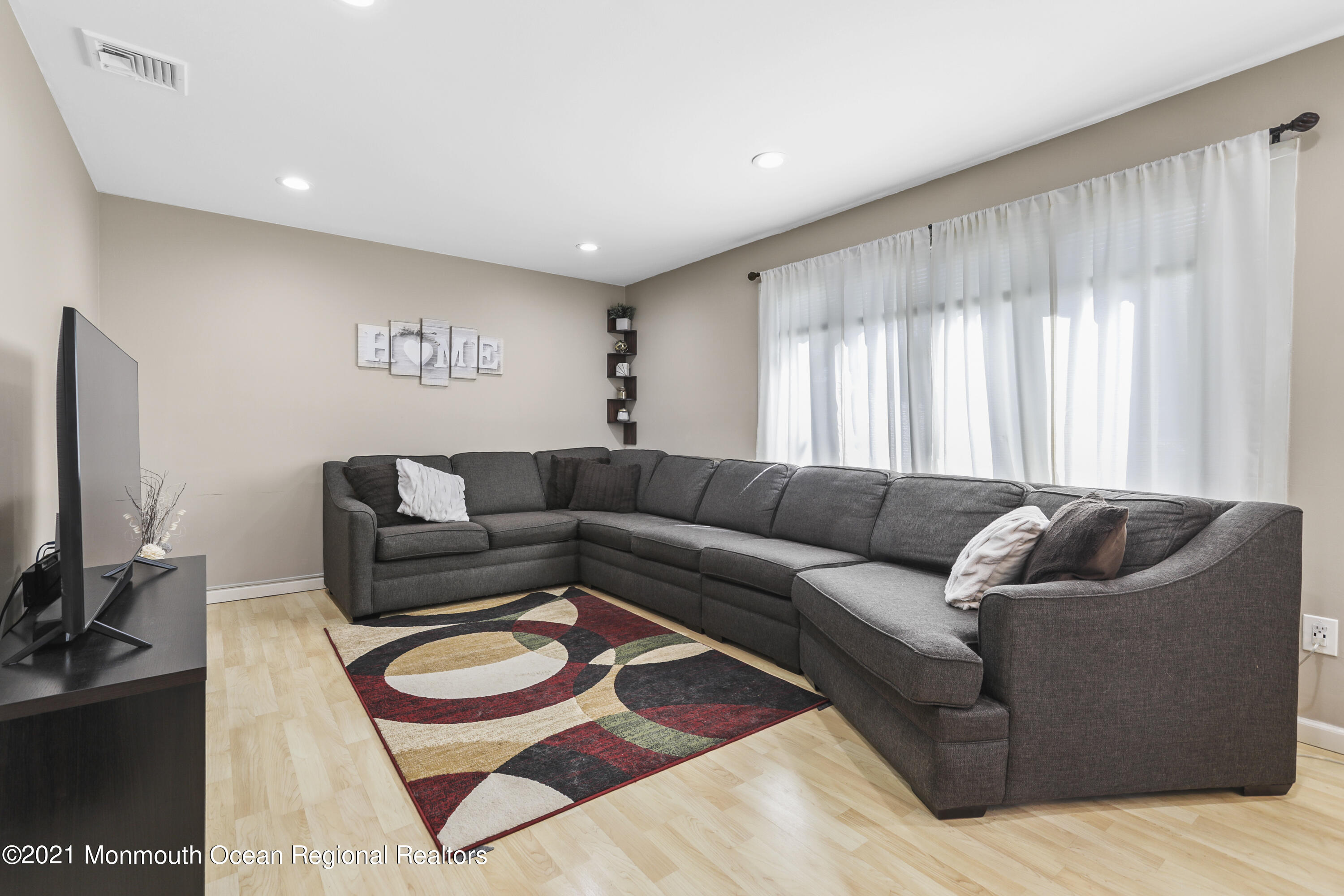 162 County Road Cliffwood, NJ 07721 - Photo 4 of 17 a living room with furniture and a flat screen tv