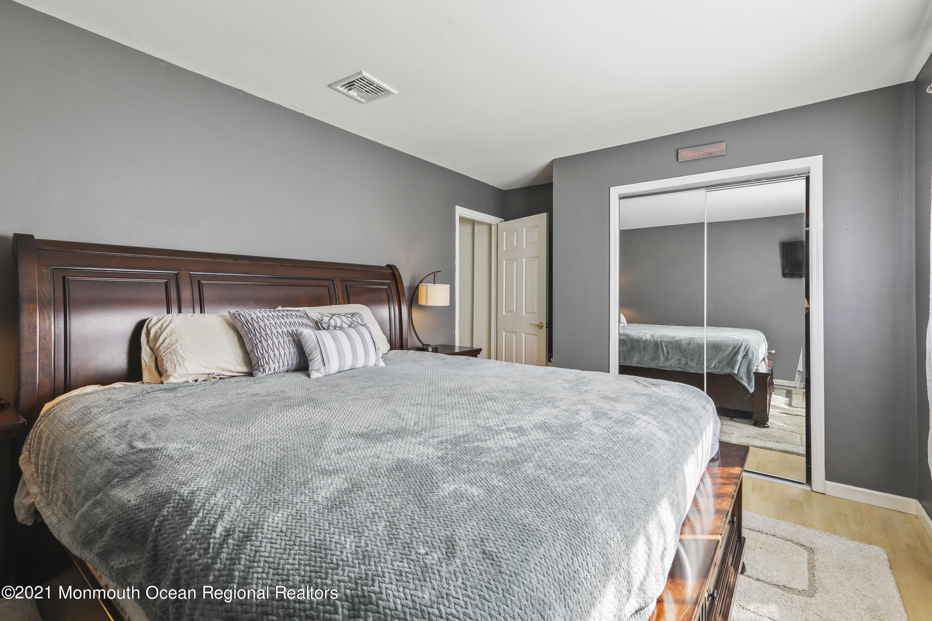 162 County Road Cliffwood, NJ 07721 - Photo 9 of 17 a bedroom with a bed and a mirror