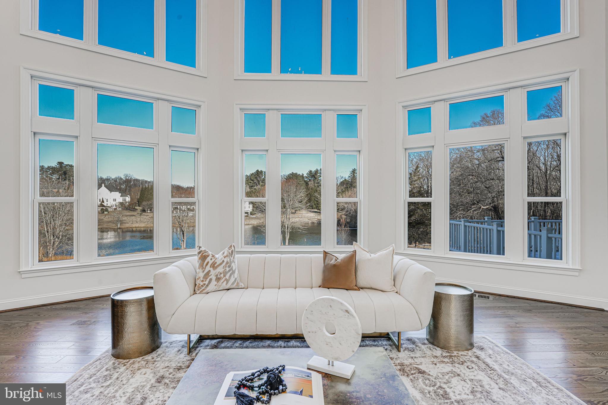 10305 Beach Mill Road Great Falls, VA 22066 - Photo 19 of 74 a living room with furniture and windows