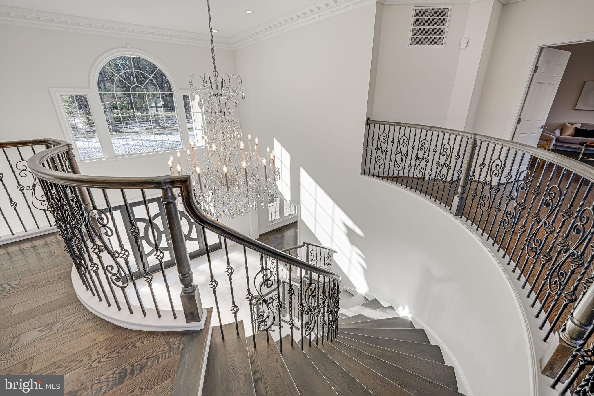 10305 Beach Mill Road Great Falls, VA 22066 - Photo 37 of 74 a view of staircase with railing and wooden floor
