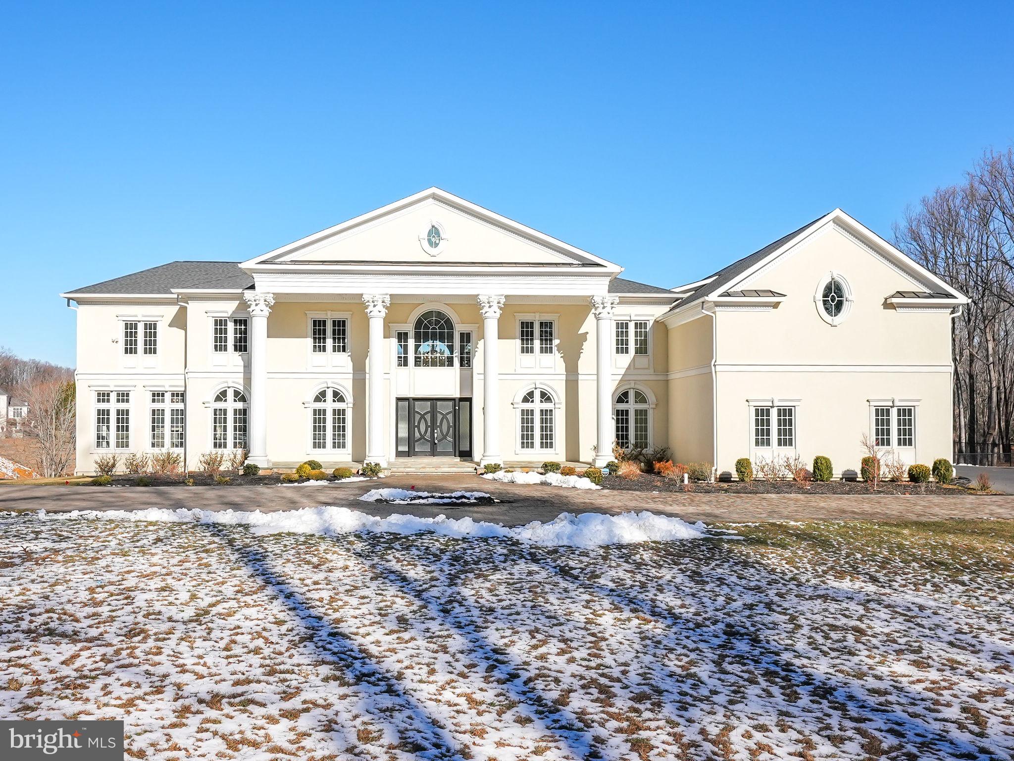 10305 Beach Mill Road Great Falls, VA 22066 - Photo 63 of 74 a front view of a house with a yard